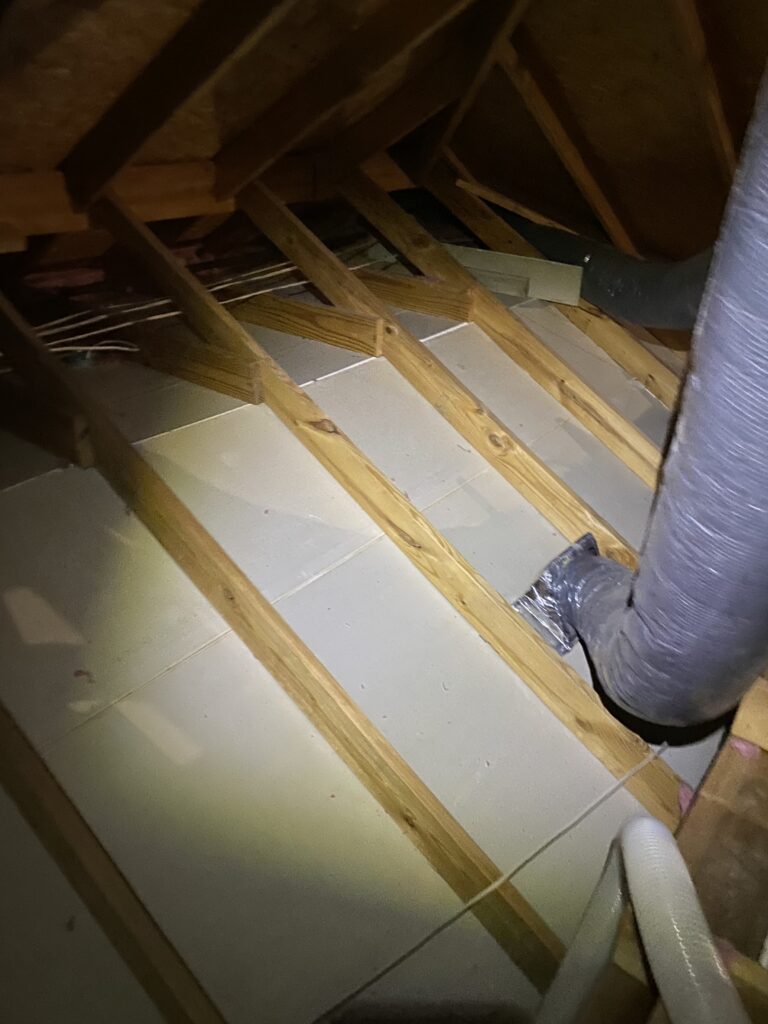 Clean attic joists ready for new insulation