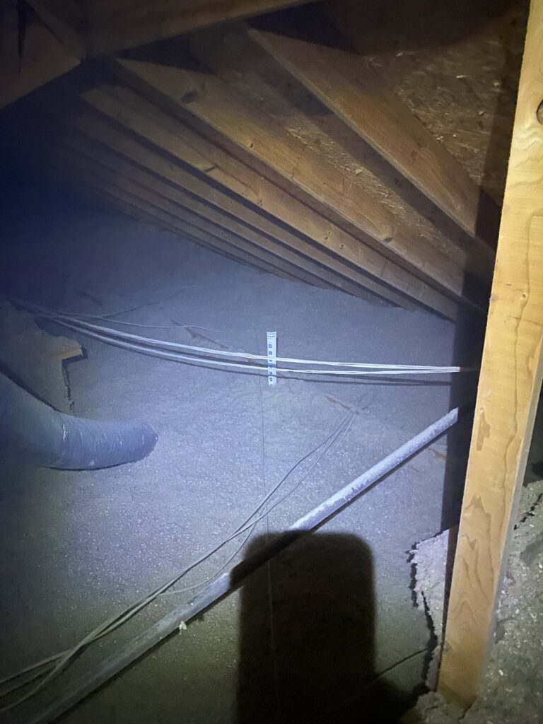 Blown-in insulation depth check