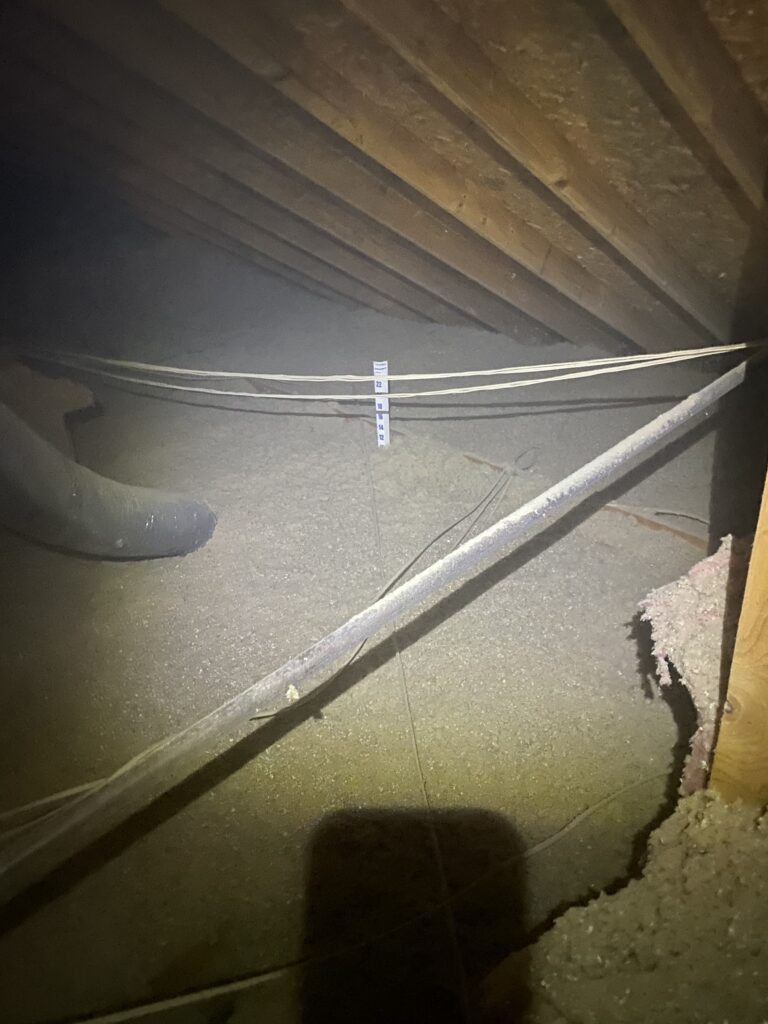 Even blown-in insulation across the attic floor