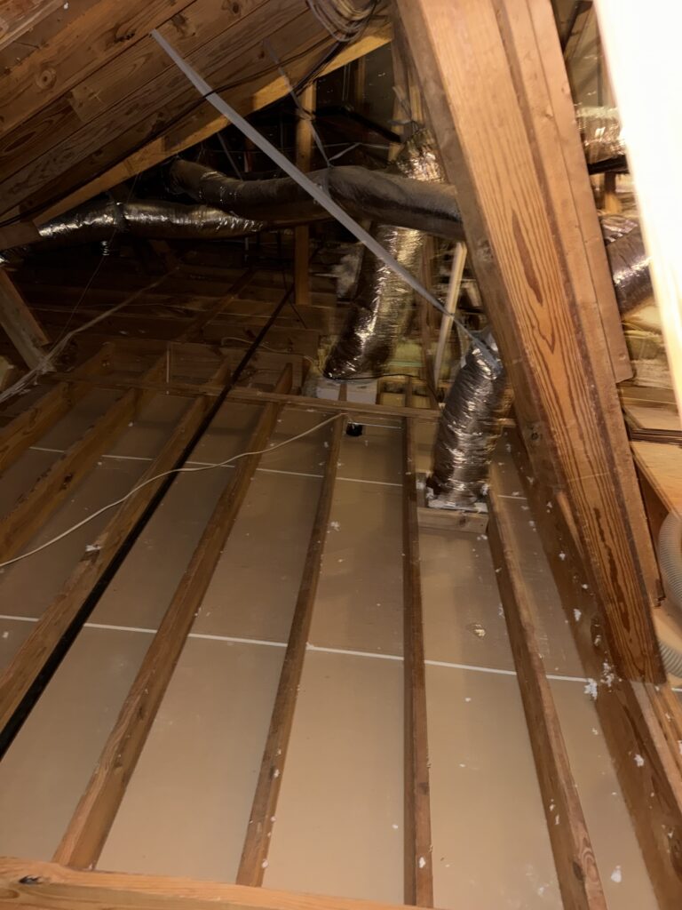 Cleaned attic floor between joists