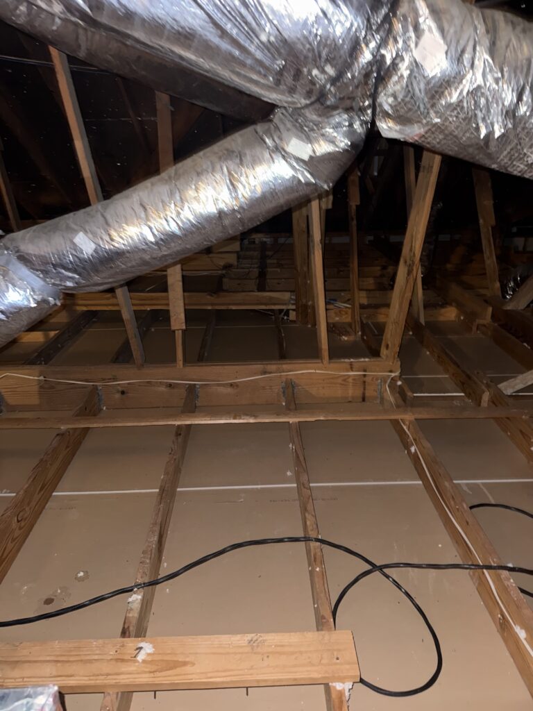 Attic ductwork after old insulation was removed