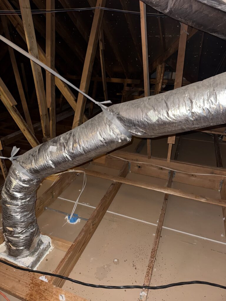 Cleared attic floor with ductwork after removal